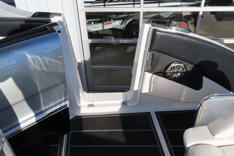 Slide: The Image of Interior view of a 2017 Mystic M4200 boat, featuring sleek design and speaker system. - 10