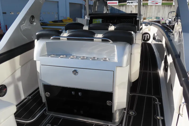 Slide: The Image of Interior of a 2017 Mystic M4200 boat, featuring sleek seating and modern design elements. - 11