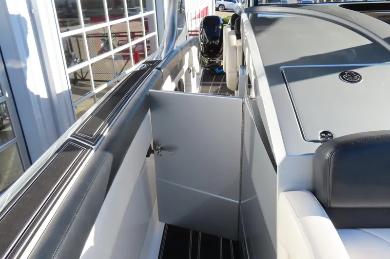 Slide: The Image of 2017 Mystic M4200 boat interior with open door, showcasing sleek design and modern features. - 23