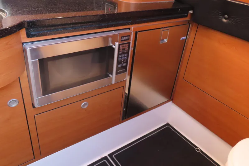 Slide: The Image of Modern kitchen area in 2017 Mystic M4200 with microwave and stainless steel appliances. - 29