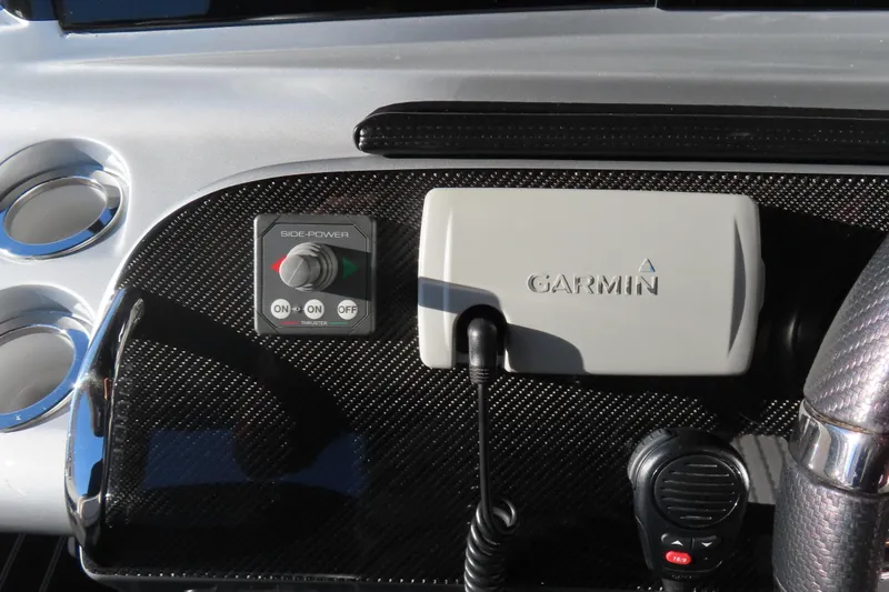 Slide: The Image of Control panel of a 2017 Mystic M4200 boat with Garmin device and side-power thruster. - 31