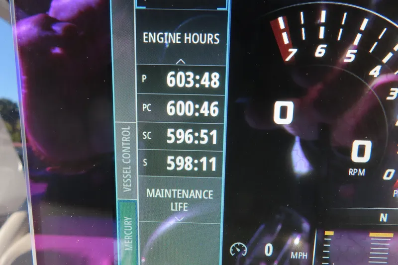Slide: The Image of Dashboard of a 2017 Mystic M4200 showing engine hours and RPM gauge. - 33