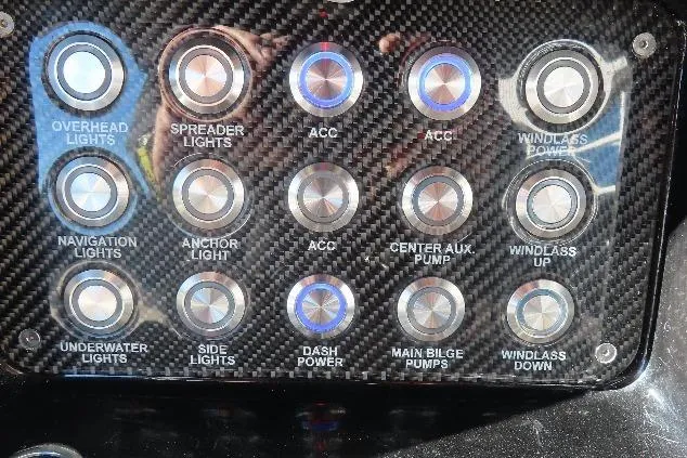 Slide: The Image of Control panel of a 2017 Mystic M4200 boat with labeled buttons for various functions. - 35
