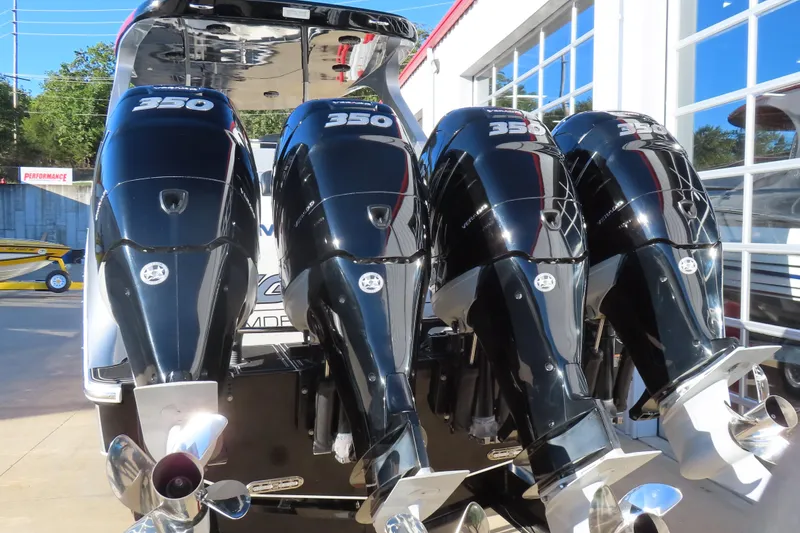 Slide: The Image of Four powerful outboard motors on a 2017 Mystic M4200 boat, showcasing performance and engineering. - 5