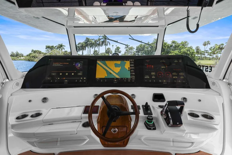 Slide: The Image of Helm of 2023 HCB 65 Estrella boat with advanced navigation and control systems. - 16