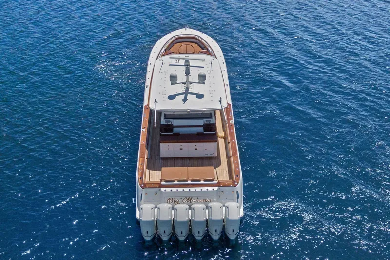 Slide: The Image of 2023 HCB 65 Estrella luxury yacht on open water, aerial view. - 2