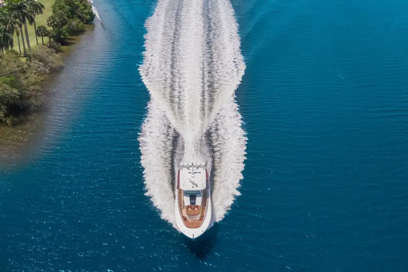 Slide: The Image of Aerial view of 2023 HCB 65 Estrella yacht cruising on blue water. - 29