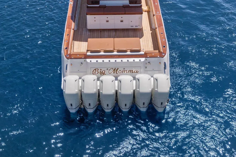 Slide: The Image of 2023 HCB 65 Estrella boat with six engines on blue ocean water. - 30