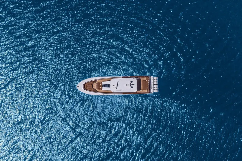 Slide: The Image of Aerial view of 2023 HCB 65 Estrella yacht on blue ocean water. - 4
