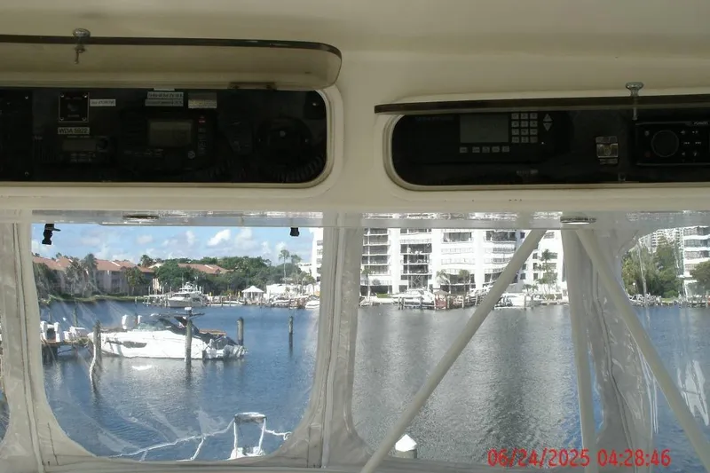 Slide: The Image of Interior view from a 1998 Ocean Yachts 48 Super Sport, overlooking a marina. - 13