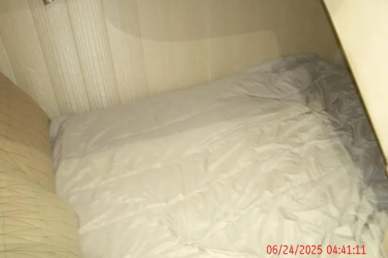 Slide: The Image of Cozy cabin bed inside 1998 Ocean Yachts 48 Super Sport. - 18