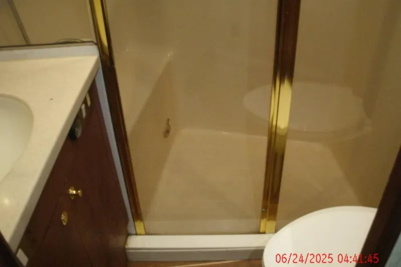 Slide: The Image of Bathroom interior of 1998 Ocean Yachts 48 Super Sport with shower and sink. - 20
