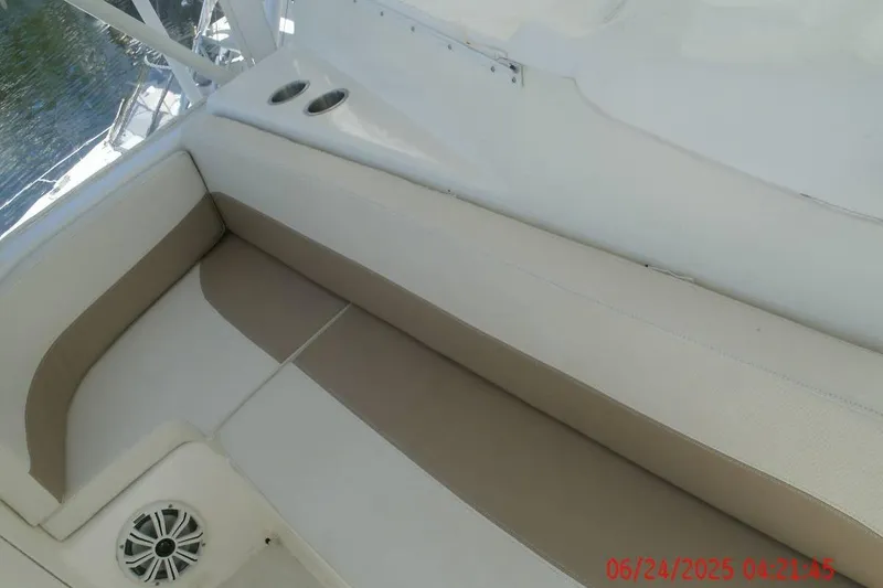 Slide: The Image of Beige and white seating on 1998 Ocean Yachts 48 Super Sport boat deck. - 9