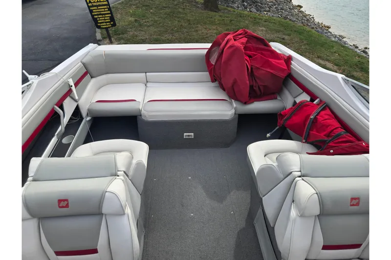 Slide: The Image of 1994 Four Winns 235 Sundowner boat interior with red and white seating. - 17