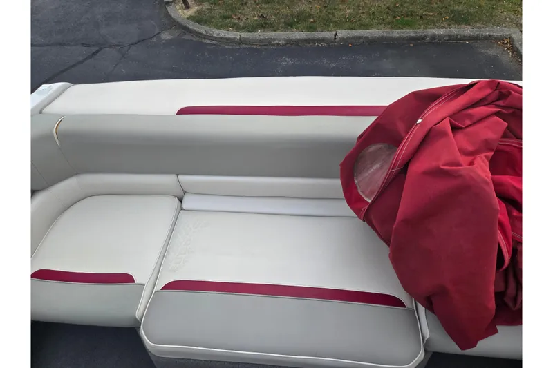 Slide: The Image of 1994 Four Winns 235 Sundowner boat interior with red and white seating. - 18