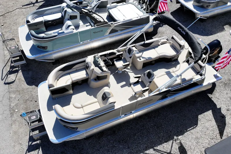 Slide: The Image of 2026 Avalon LSZ Quad Lounger Shift pontoon boat with spacious seating and sleek design. - 10