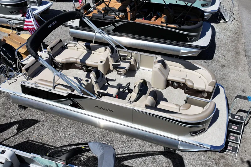 Slide: The Image of 2026 Avalon LSZ Quad Lounger Shift pontoon boat with luxurious seating and sleek design. - 13