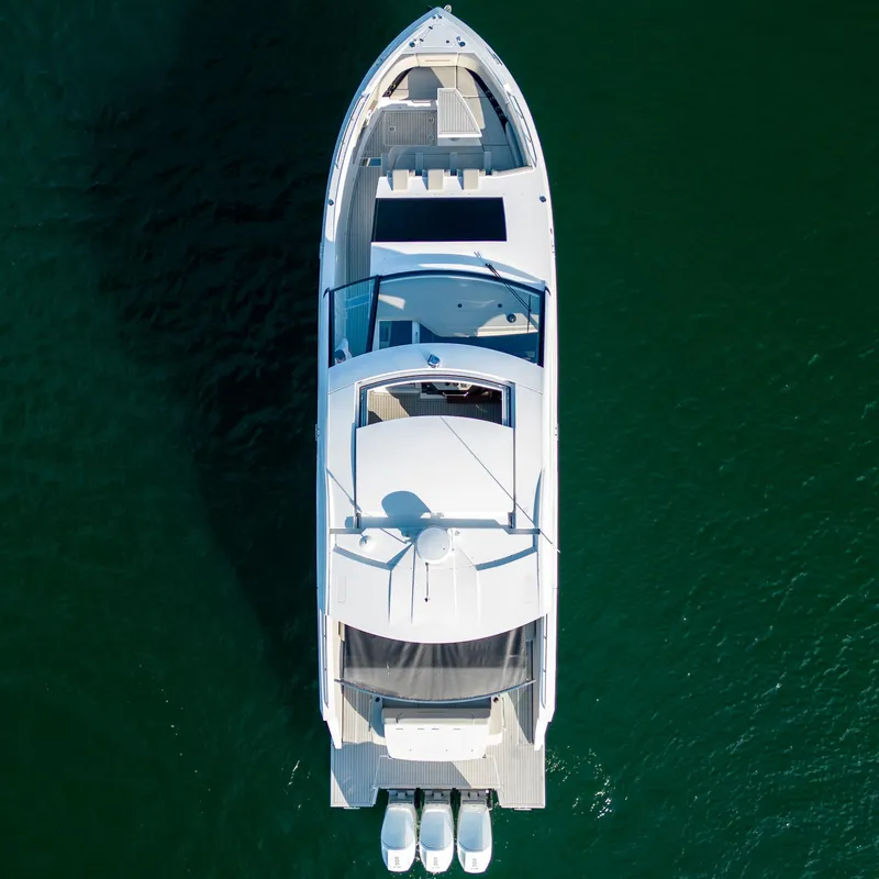 Slide: The Image of Top view of 2024 Cruisers Yachts 50 GLS on water. - 8