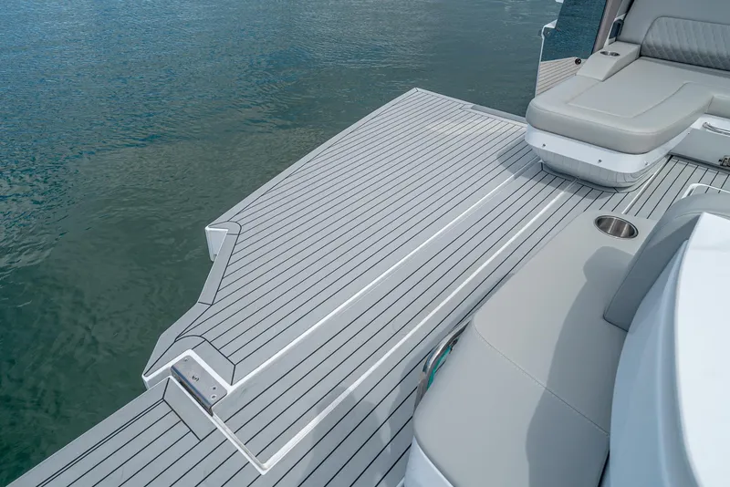 Slide: The Image of 2024 Cruisers Yachts 50 GLS swim platform and seating area. - 33