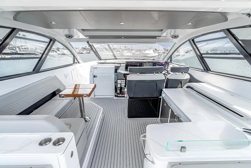 Slide: The Image of Interior of 2024 Cruisers Yachts 50 GLS, luxury seating and panoramic windows. - 38