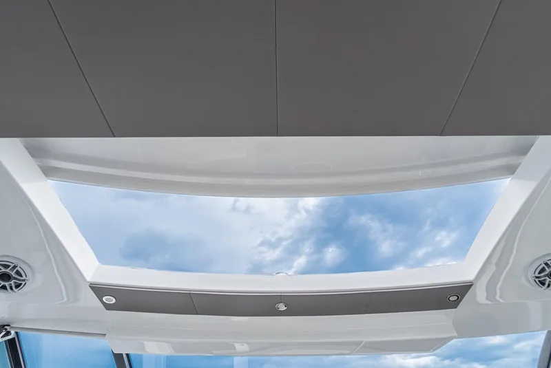 Slide: The Image of 2024 Cruisers Yachts 50 GLS panoramic sunroof with sky view. - 45