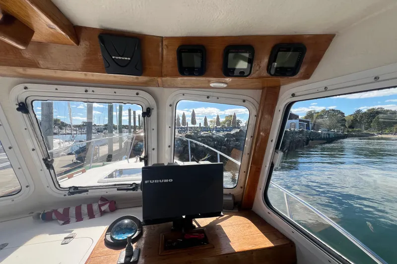 Slide: The Image of Interior view of a 2007 Eastern 27 Islander boat with navigation equipment. - 7