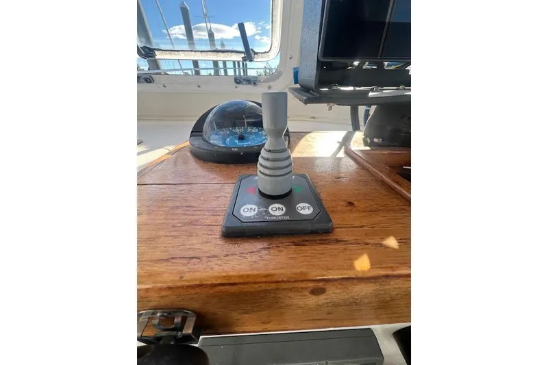 Slide: The Image of Control panel of a 2007 Eastern 27 Islander boat with thruster switch. - 8