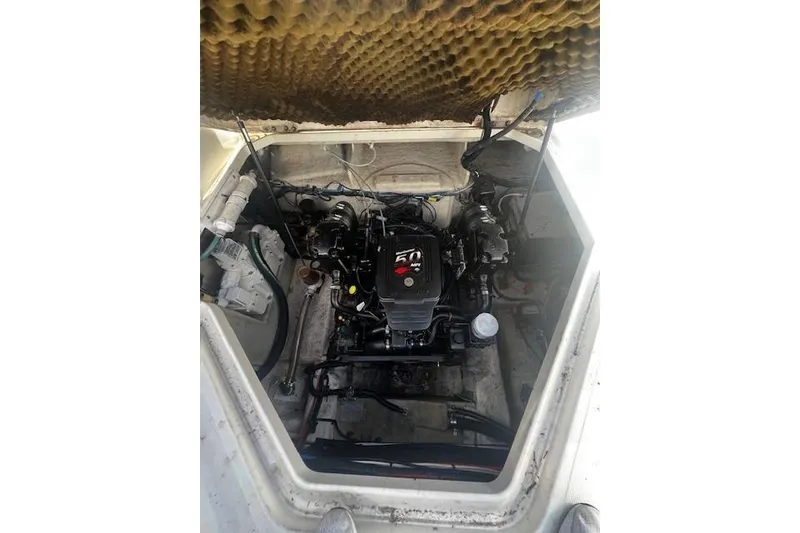 Slide: The Image of Engine compartment of a 2006 Searay 240 Sundancer boat, showcasing the motor. - 5