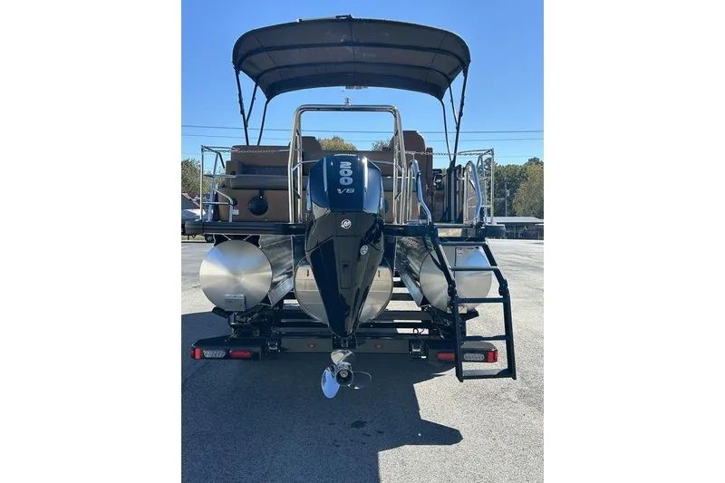 Slide: The Image of 2026 Harris Cruiser 250 LUX pontoon boat with powerful V6 engine, rear view. - 5