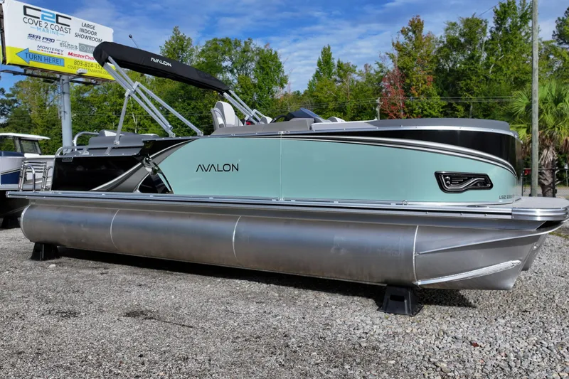 The Image of 2026 Avalon LSZ Quad Lounger Shift pontoon boat displayed outdoors. - 0
