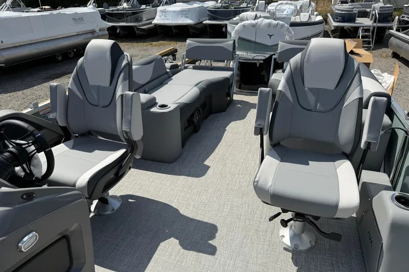 Slide: The Image of 2026 Avalon LSZ Quad Lounger Shift boat interior with plush gray seating and modern design. - 12