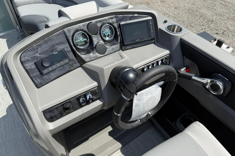 Slide: The Image of 2026 Avalon LSZ Quad Lounger Shift dashboard with steering wheel and control panel. - 13