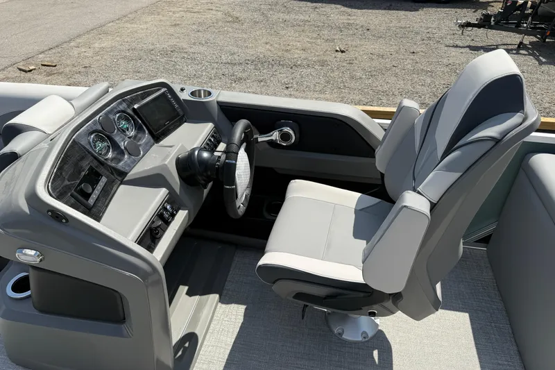 Slide: The Image of 2026 Avalon LSZ Quad Lounger Shift boat helm with modern controls and comfortable captain's chair. - 15