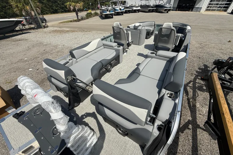 Slide: The Image of 2026 Avalon LSZ Quad Lounger Shift pontoon boat with spacious seating and modern design. - 9