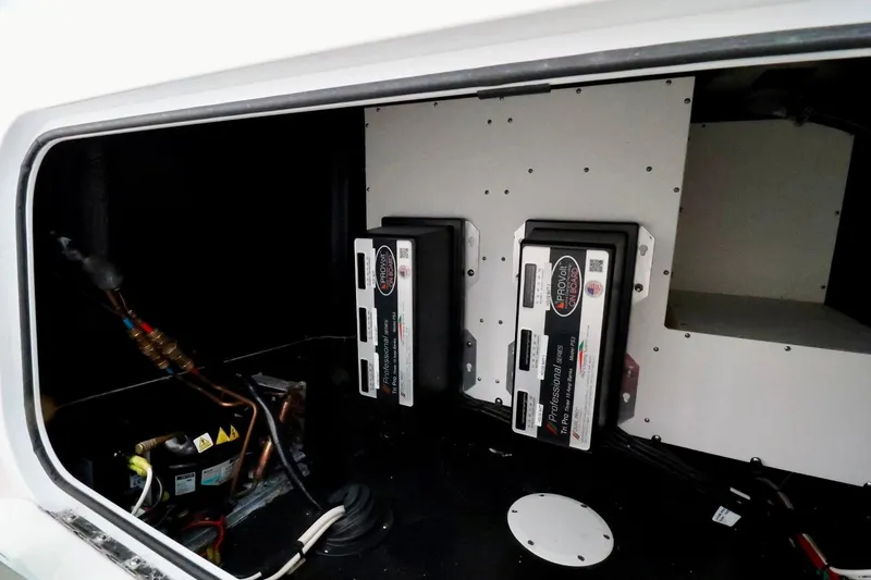 Slide: The Image of 2023 Yellowfin 42 Offshore boat electrical compartment with ProVolt battery chargers. - 17