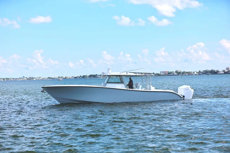 Slide: The Image of 2023 Yellowfin 42 Offshore boat cruising on a sunny day. - 23