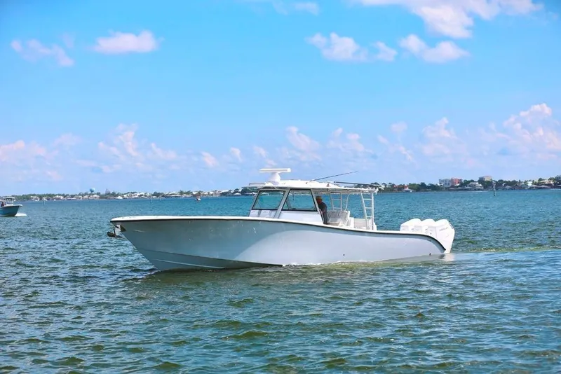Slide: The Image of 2023 Yellowfin 42 Offshore boat cruising on a sunny day in calm waters. - 25