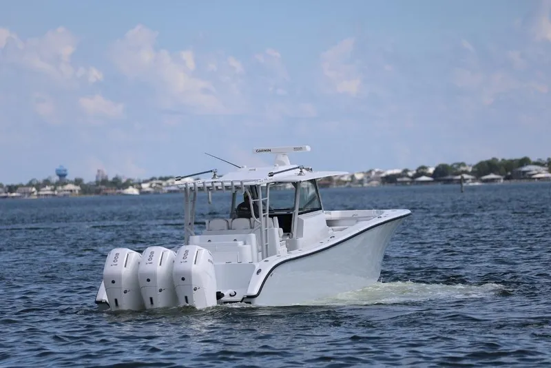 Slide: The Image of 2023 Yellowfin 42 Offshore boat cruising on open water. - 36