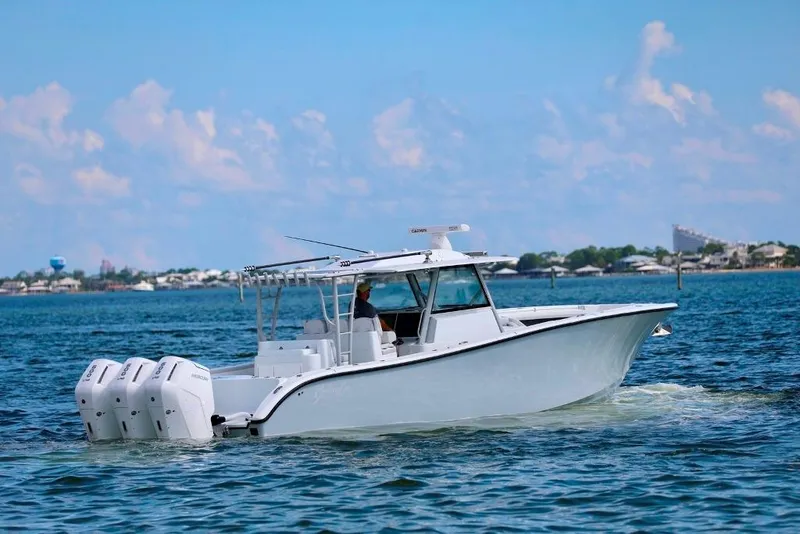 Slide: The Image of 2023 Yellowfin 42 Offshore boat cruising on open water. - 37