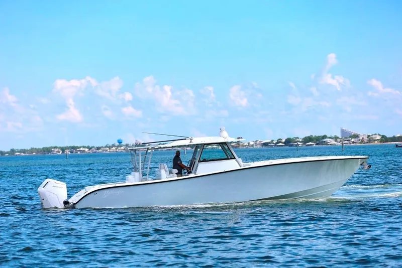 Slide: The Image of 2023 Yellowfin 42 Offshore boat cruising on a sunny day. - 39