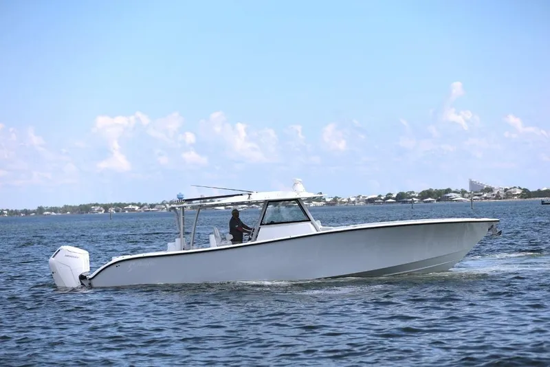 Slide: The Image of 2023 Yellowfin 42 Offshore boat cruising on open water under clear skies. - 40