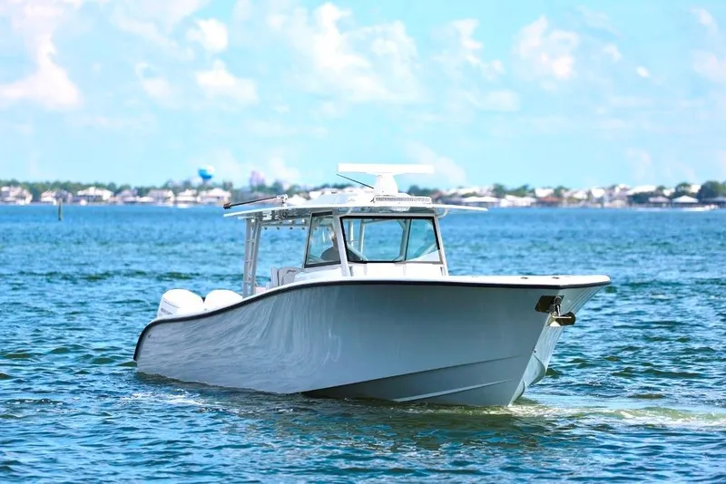 Slide: The Image of 2023 Yellowfin 42 Offshore boat cruising on a sunny day in open water. - 42
