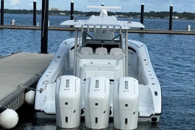 Slide: The Image of 2023 Yellowfin 42 Offshore boat docked with triple 600 V12 engines. - 46