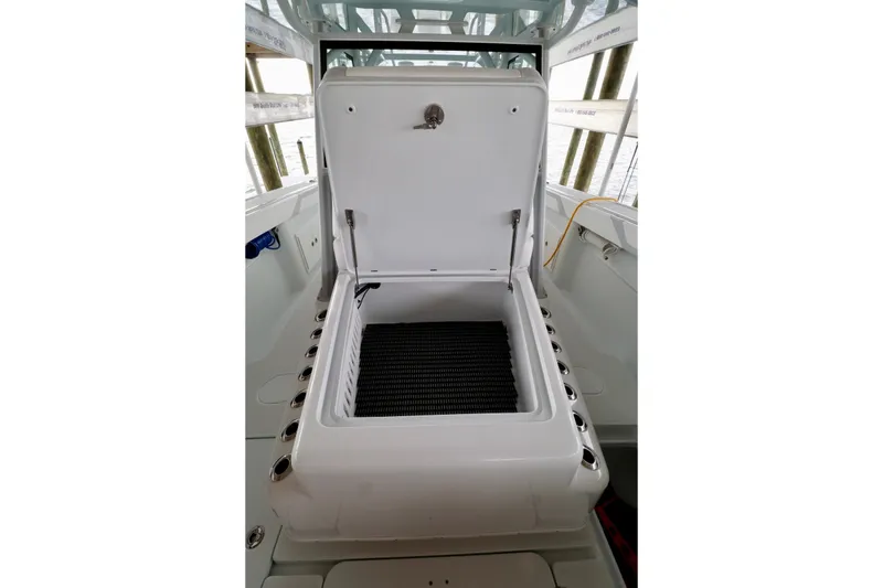 Slide: The Image of Open storage compartment on 2023 Yellowfin 42 Offshore boat. - 8