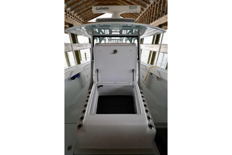 Slide: The Image of 2023 Yellowfin 42 Offshore boat with open storage compartment under a covered dock. - 9