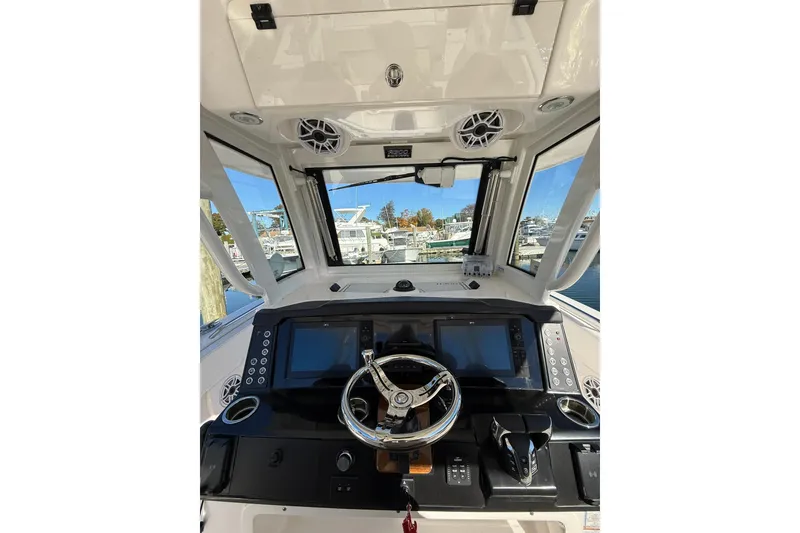 Slide: The Image of 2025 Robalo R300 Center Console engine compartment with Seakeeper 2 stabilization system. - 13