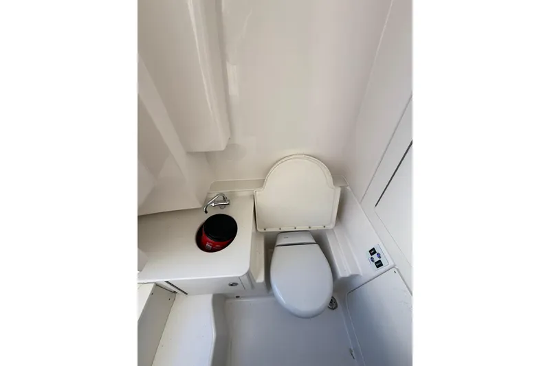 Slide: The Image of 2025 Robalo R300 Center Console helm with dual screens and modern controls. - 17