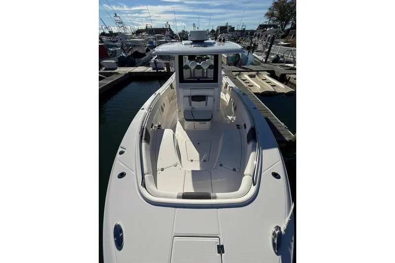 Slide: The Image of 2025 Robalo R300 Center Console interior with speakers and navigation equipment. - 19