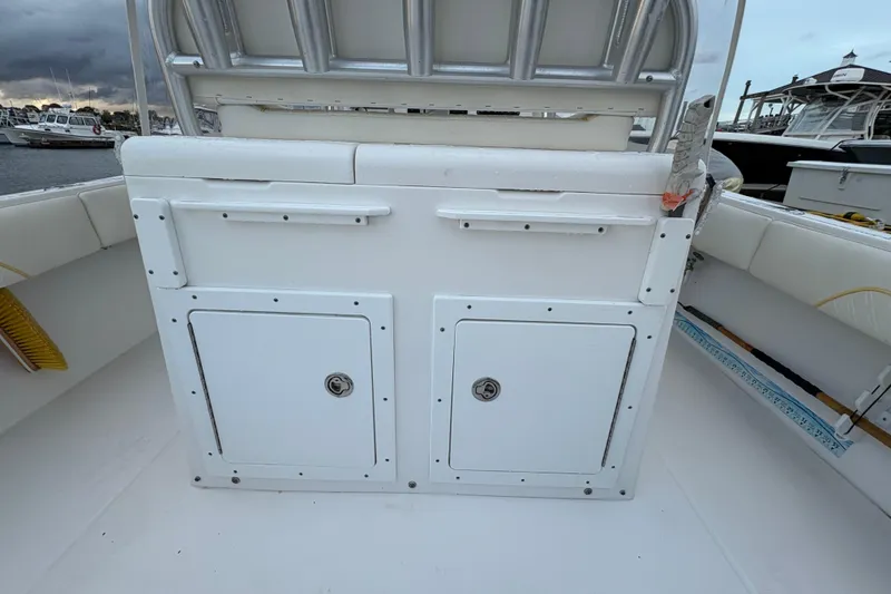 Slide: The Image of 2006 Regulator 32 Forward Seating boat interior with storage compartments. - 20