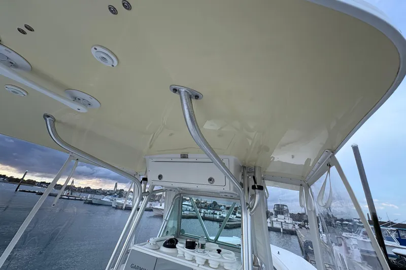 Slide: The Image of 2006 Regulator 32 Forward Seating boat interior with view of marina and overcast sky. - 22